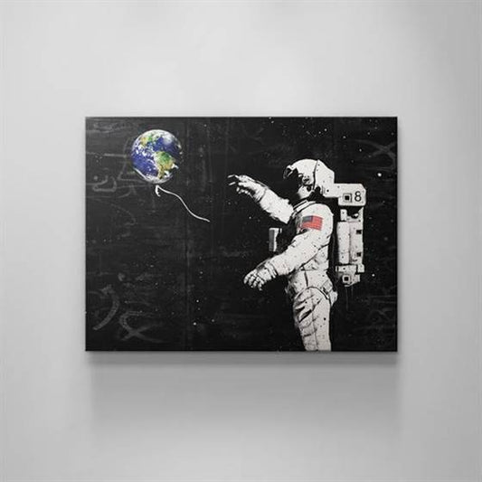 Astronaut with an earth balloon canvas